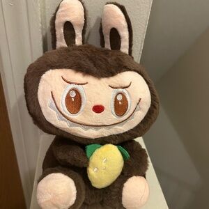 Brown Labubu With a Lemon